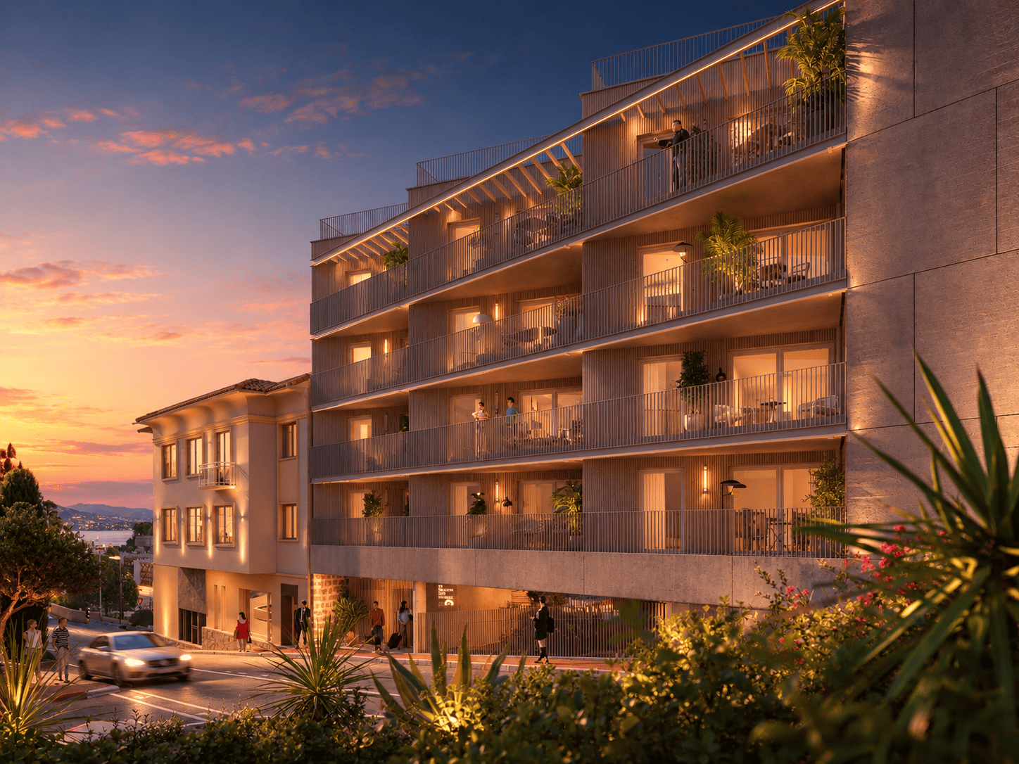 Building exterior with sea in the distance at dusk - Le Balcon des Salines | New Apartments for Sale in Cap d'Ail