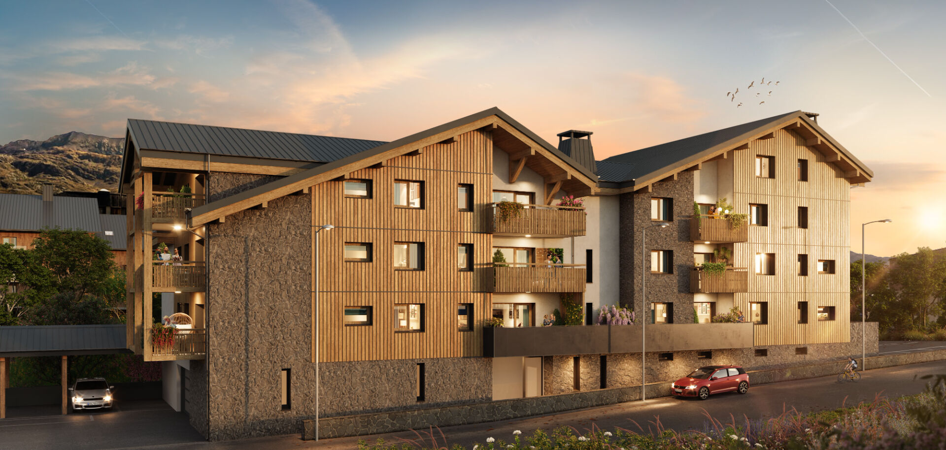 Les Grangettes - New Apartments For Sale in Alpe d'Huez - building exterior non-winter golden hour